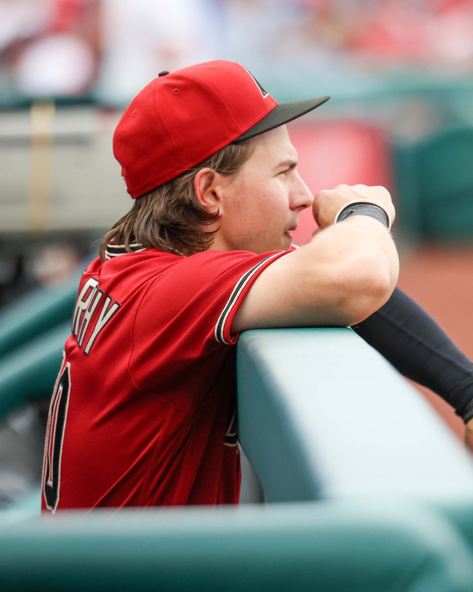 Jake McCarthy looking on from the dugout at Citizens Bank Park in June 2022, while with the Arizona Diamondbacks.